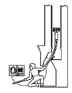 Technician Performing a Video Scan Inspection in a Fireplace Flue